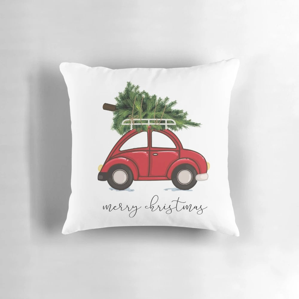 A cozy Christmas tree pillow set against a red car, creating a charming holiday scene.