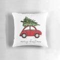 A cozy Christmas tree pillow set against a red car, creating a charming holiday scene.