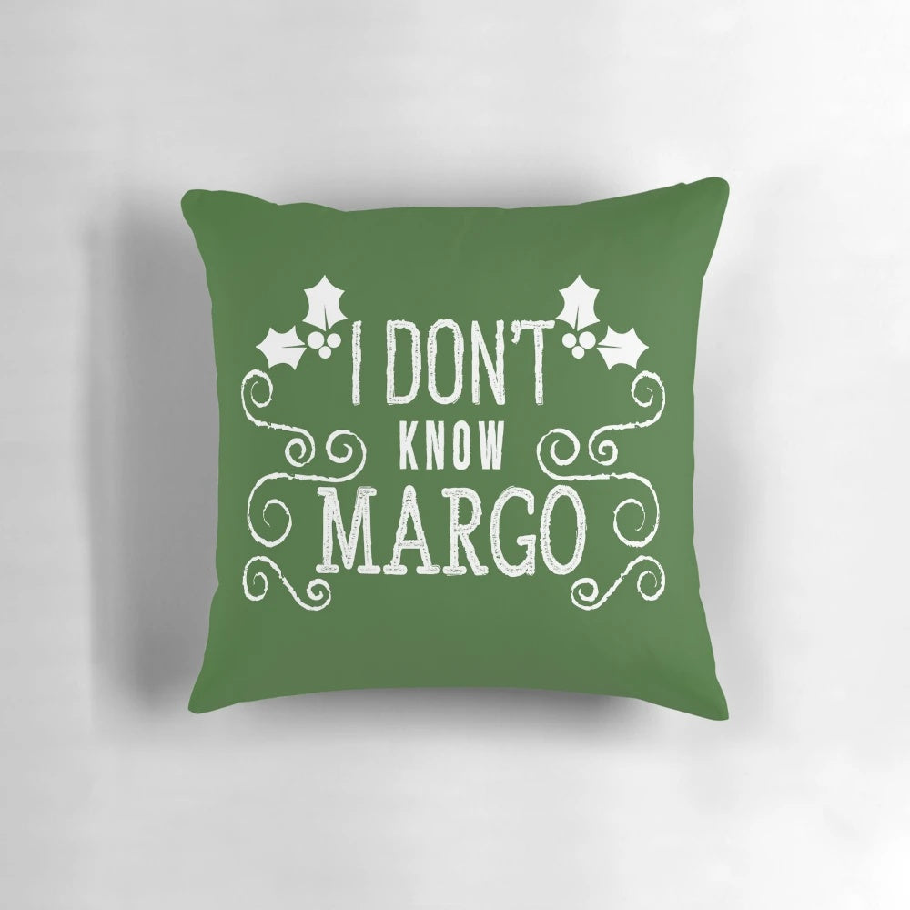 Decorative pillow featuring a quote from the movie "Christmas Vacation" with the characters Todd and Margo, designed by Kelly Design Company.