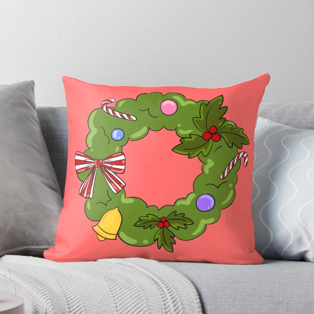 A cozy Christmas wreath pillow with green, red, bells, and candy decorations.