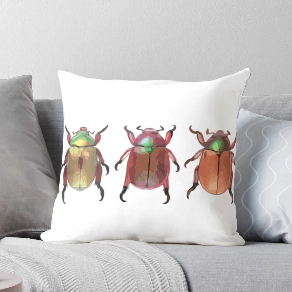 A digital painting of three cute Christmas beetles on a decorative throw pillow.
