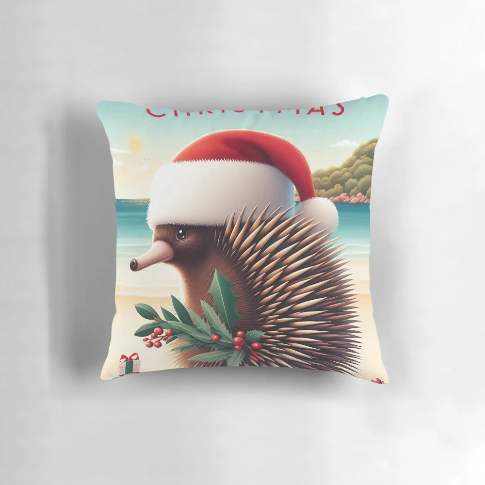 A cozy Christmas pillow featuring an illustrated echidna wearing a Santa hat, surrounded by eucalyptus leaves and a festive holiday design.