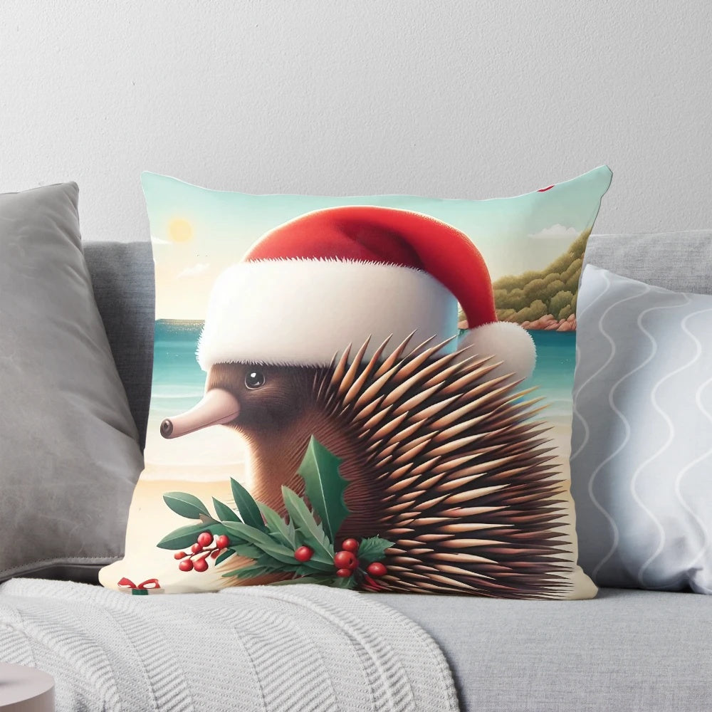 A cozy Christmas pillow featuring an illustrated echidna wearing a Santa hat, surrounded by eucalyptus leaves and a festive holiday design.