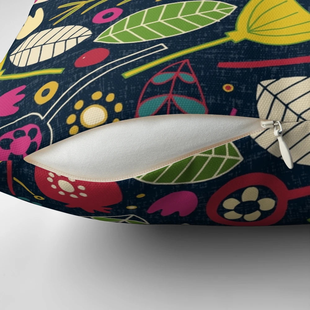 Decorative throw pillow featuring a festive floral and bird pattern in shades of indigo blue
