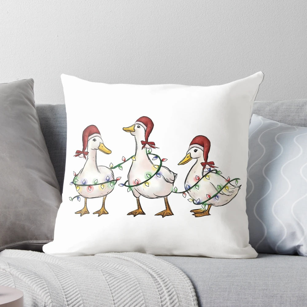 A cozy and whimsical Christmas pillow featuring humorous ducks and holiday lights, perfect for spreading cheer.