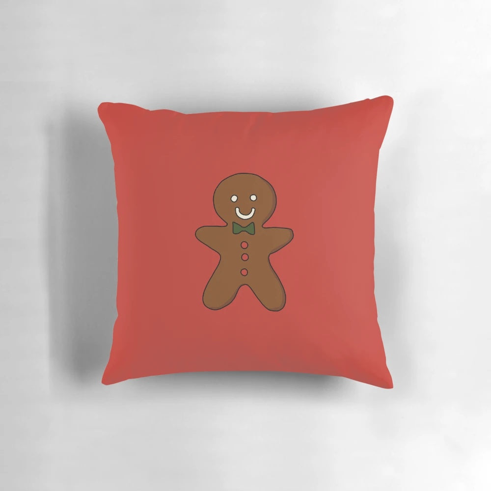 Plush gingerbread man shaped holiday pillow for Christmas and winter home decor