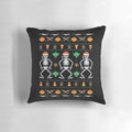 A decorative holiday pillow featuring a mix of Halloween and Christmas elements, including jack-o-lanterns, gingerbread men, and a festive knit pattern.