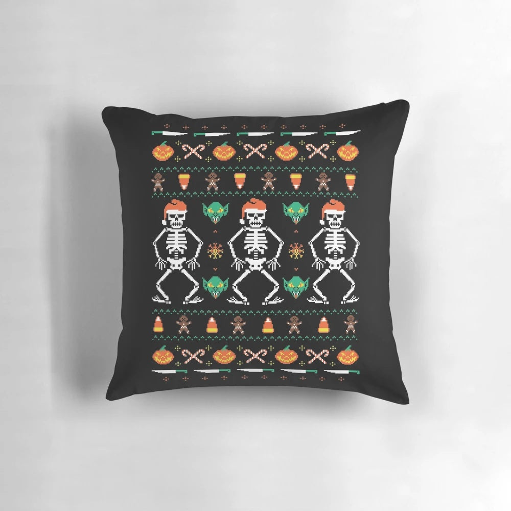 A decorative holiday pillow featuring a mix of Halloween and Christmas elements, including jack-o-lanterns, gingerbread men, and a festive knit pattern.