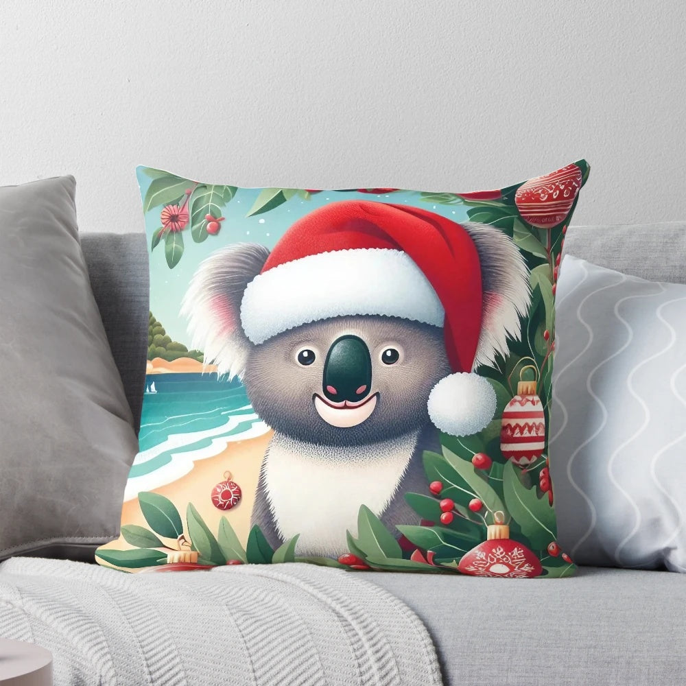 Cute Aussie koala wearing a Santa hat on a Christmas-themed pillow with eucalyptus leaves and a beach backdrop.