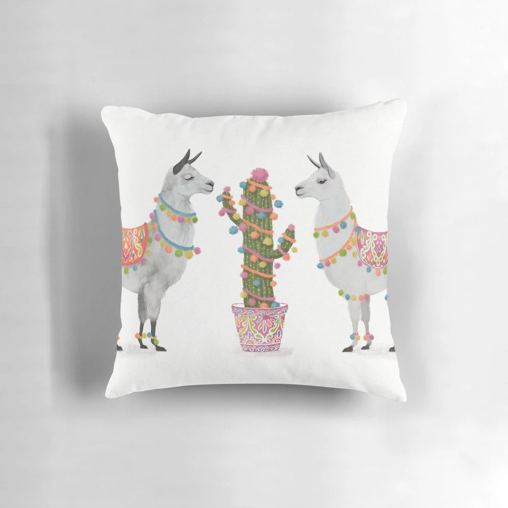 A colorful pillow featuring a vibrant llama illustration against a southwest-inspired pattern.