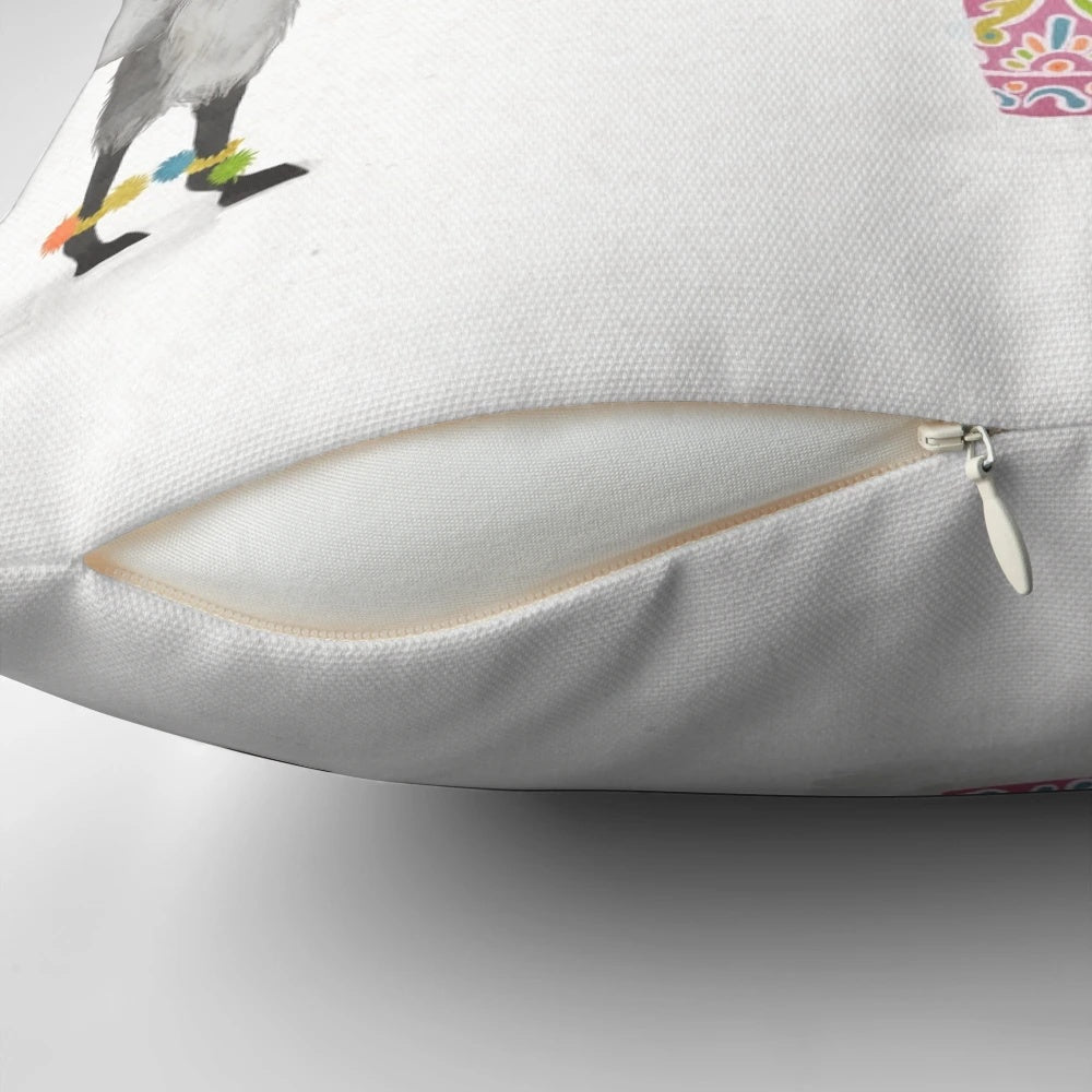 A colorful pillow featuring a vibrant llama illustration against a southwest-inspired pattern.