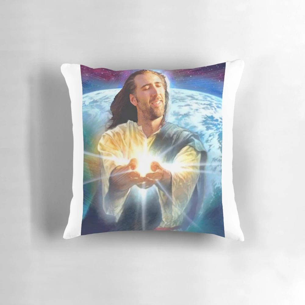 A decorative pillow featuring a parody image of Nicolas Cage's face overlaid with Christian imagery and text