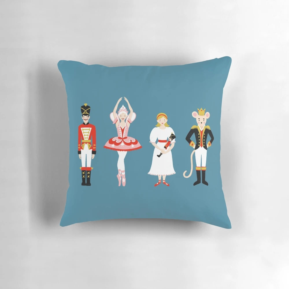 A cozy and decorative Nutcracker Ballet-themed pillow featuring classic Christmas characters like the Nutcracker, Sugar Plum Fairy, and Mouse King.