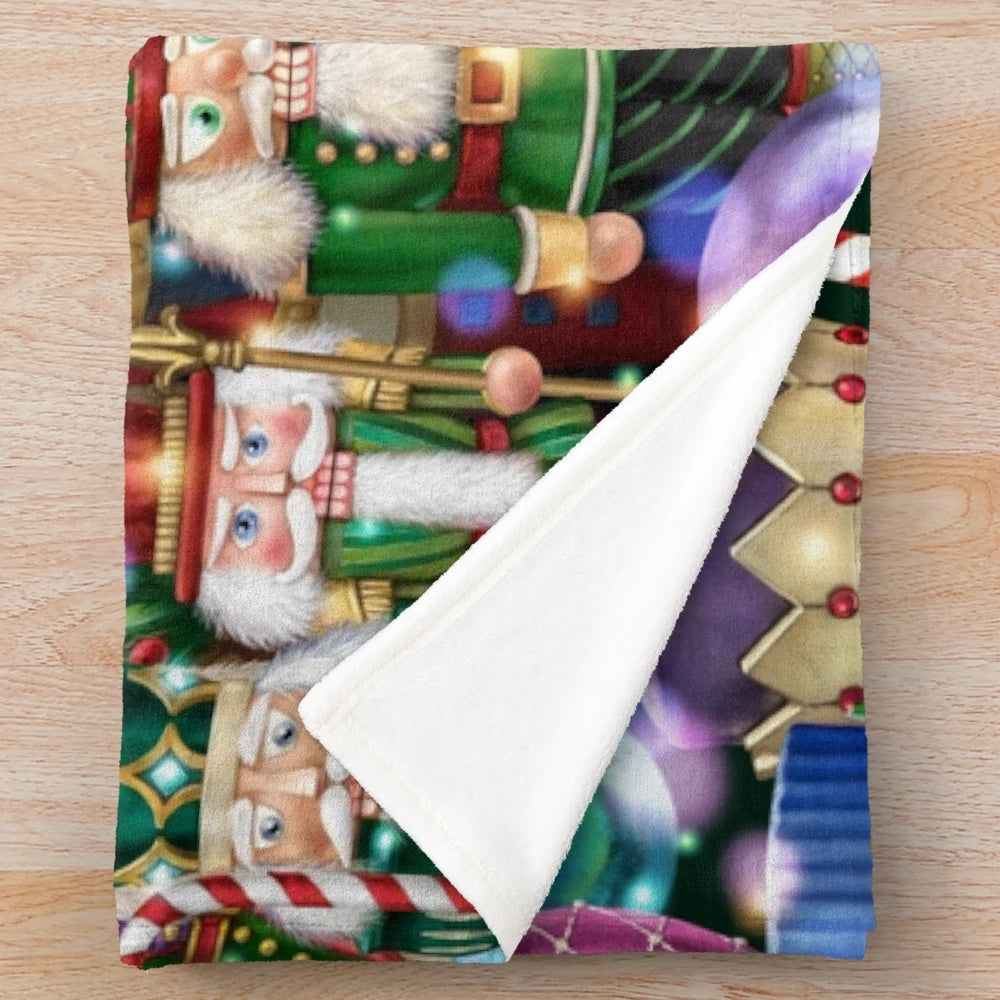 Plush blanket featuring an array of nutcracker figures in a festive holiday setting