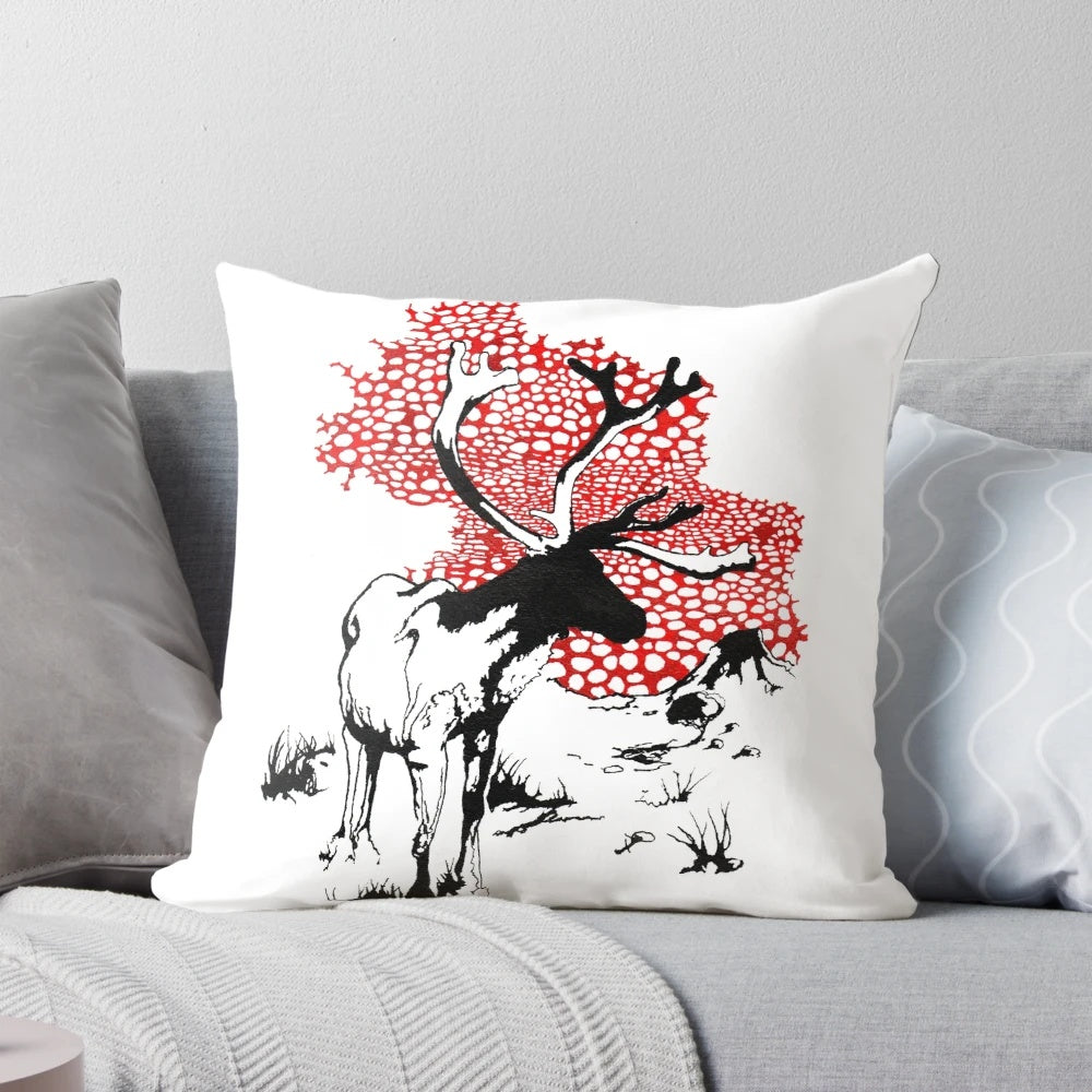 Decorative pillow featuring a hand-drawn reindeer with red and white mushrooms in a natural landscape