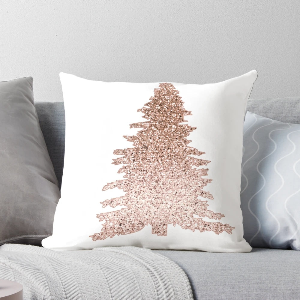 A decorative throw pillow featuring a sparkling rose gold Christmas tree with abstract leaves and holiday accents.