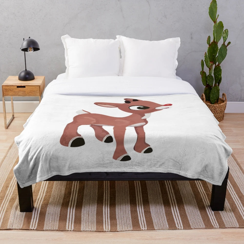 Soft and cozy plush blanket featuring the classic Rudolph the Red Nosed Reindeer design