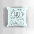 A black pillow with the text "emotionally attached to fictional characters" printed on it.