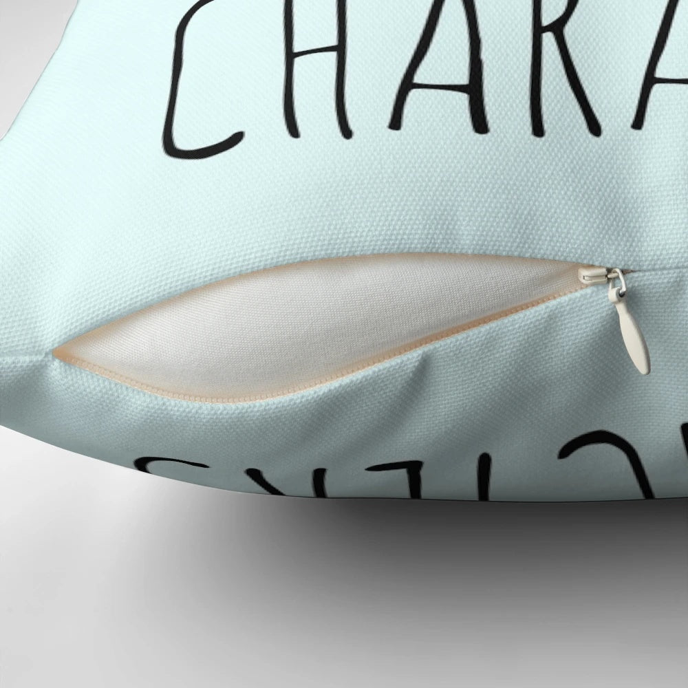 A black pillow with the text "emotionally attached to fictional characters" printed on it.