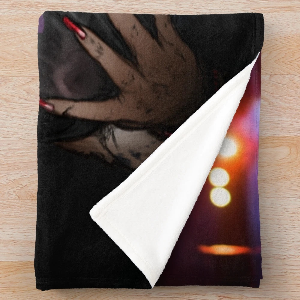 A plush blanket featuring a fierce, dark hyena in a heavy metal style artwork.