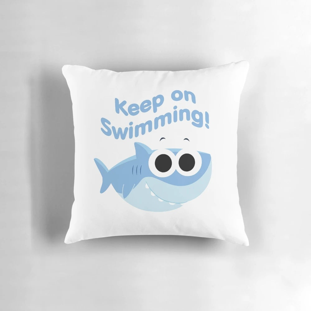 Finny the Shark plush pillow with "Keep On Swimming" text and cartoon shark design