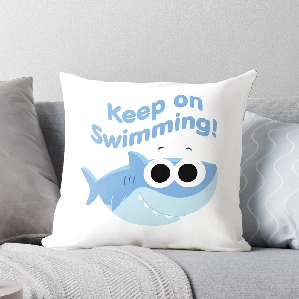 Finny the Shark plush pillow with "Keep On Swimming" text and cartoon shark design