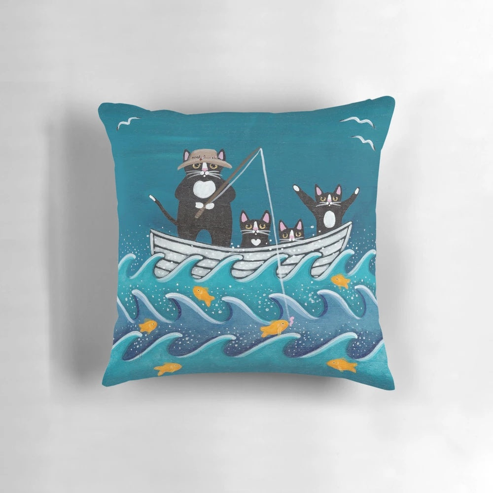 Pillow featuring a father and child fishing on a boat with cats and fish in the water