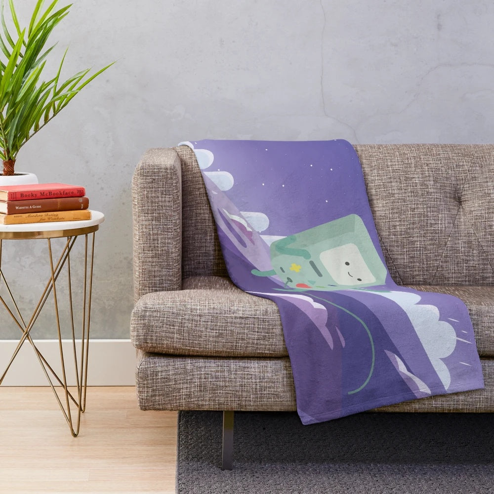 Floating BMO from Adventure Time on a plush, cozy blanket