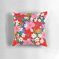Vibrant floral pattern decorative pillow with pink and white daisies
