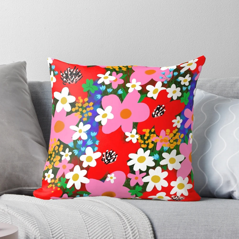 Vibrant floral pattern decorative pillow with pink and white daisies