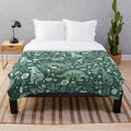 Cozy floral dinosaur plush blanket with folk art inspired design