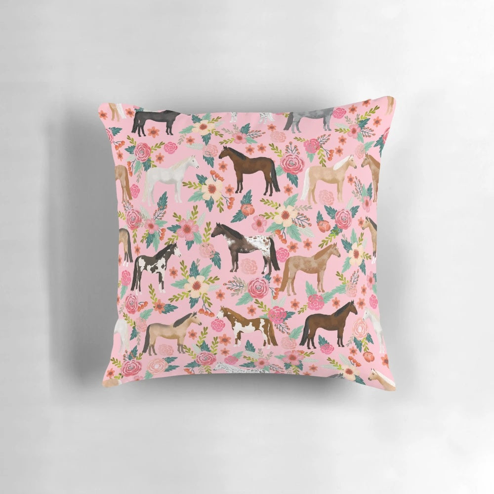 Soft, decorative pillow featuring a colorful floral pattern and various horse breeds