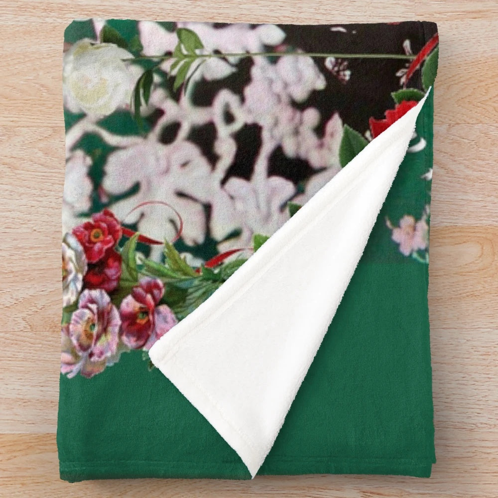 Floral plush blanket featuring Frida Kahlo's artwork and inspirational imagery
