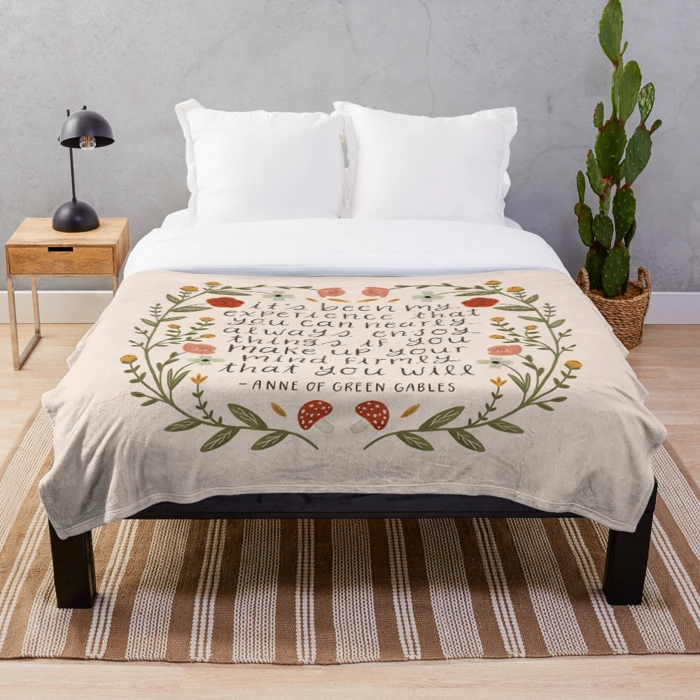 Floral plush blanket with "Enjoy Things" quote from Anne of Green Gables