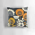 Closeup of a floral patterned pillow in cream, orange, yellow, and blue colors inspired by Finnish design.