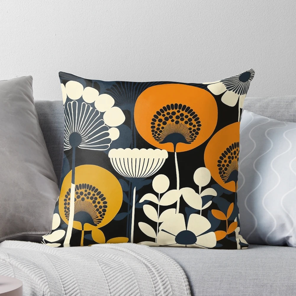 Closeup of a floral patterned pillow in cream, orange, yellow, and blue colors inspired by Finnish design.