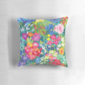 Floral throw pillow with vibrant spring flowers and patterns