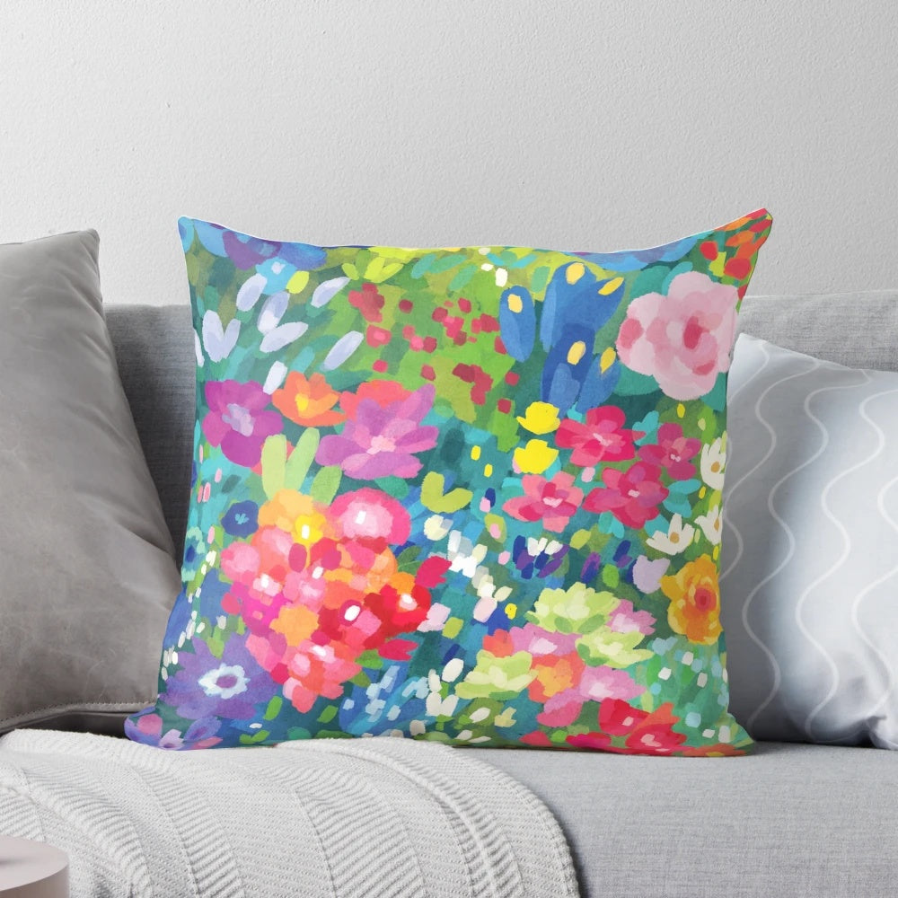 Floral throw pillow with vibrant spring flowers and patterns