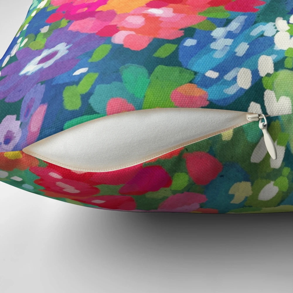 Floral throw pillow with vibrant spring flowers and patterns