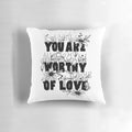 Floral-patterned decorative pillow with the text "You Are Worthy of Love