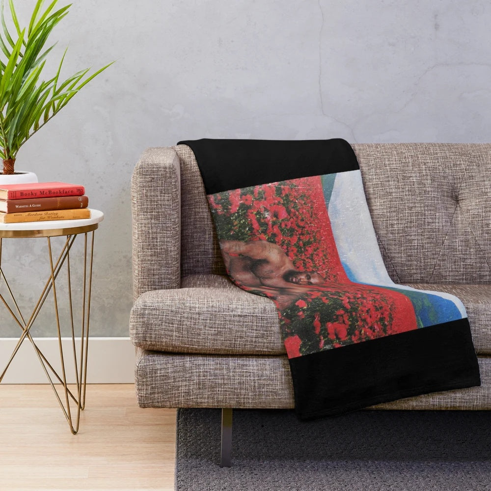 Plush blanket with an image of the famous Barry Wood meme in a flower field