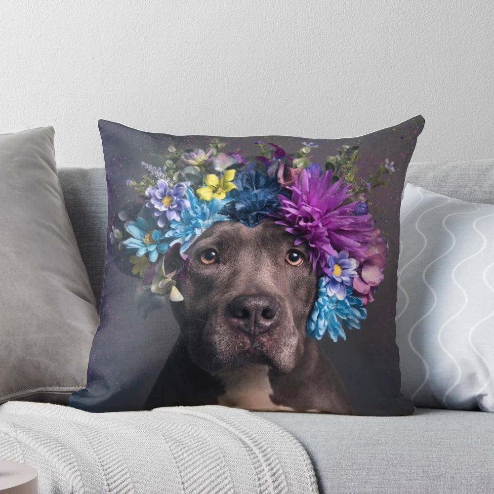 A Flower Power-themed pillow featuring a portrait of a pitbull dog with a flower crown.