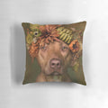 A plush pillow featuring a pit bull wearing a colorful flower crown against a botanical background.