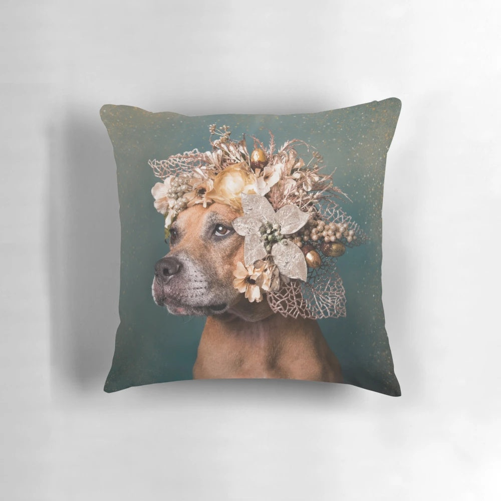 A vibrant, flower-adorned pillow featuring a playful pitbull puppy, symbolizing the joy and hope of animal rescue.