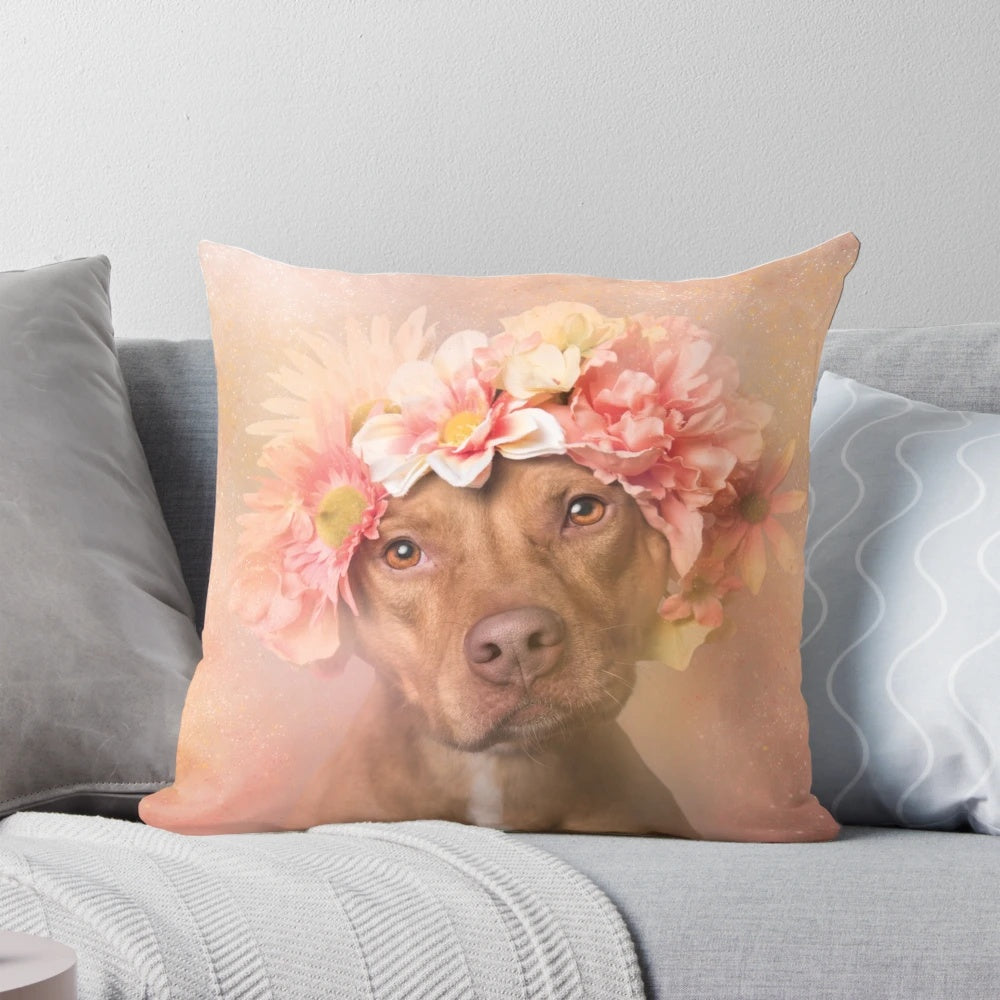 A colorful pillow featuring a pit bull wearing a flower crown, representing the power of rescue dogs.