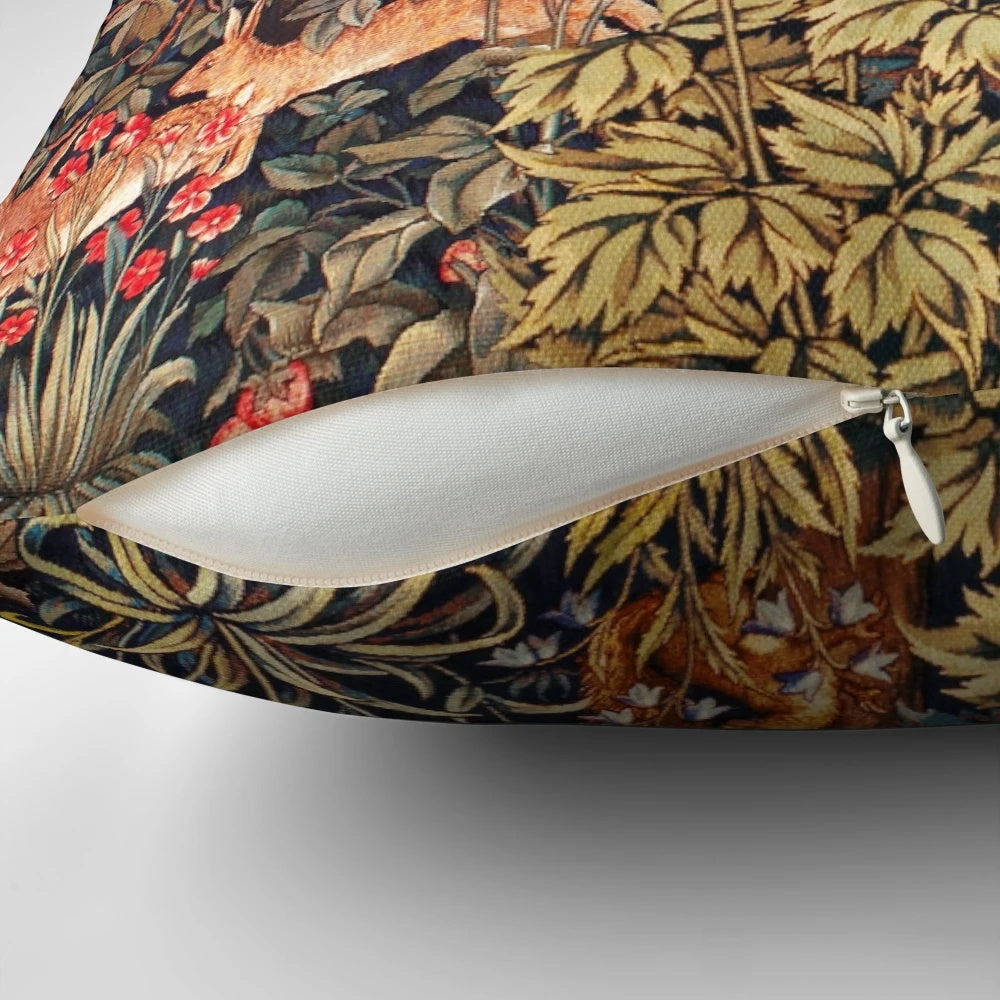 A vibrant tapestry pillow featuring an autumn forest scene with animals like a pheasant, squirrel, and hares.