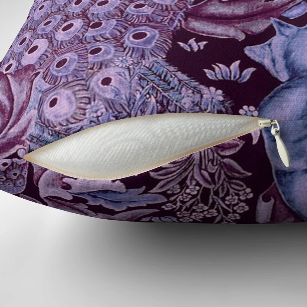 Decorative throw pillow featuring a whimsical forest animal and peacock floral pattern in shades of blue and purple.