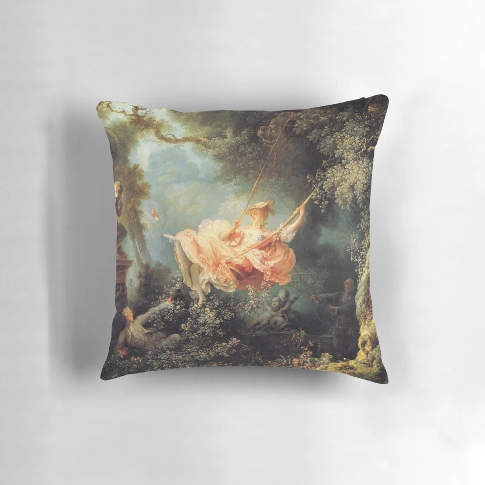 Decorative pillow featuring the famous painting "The Swing" by French artist Jean-Honoré Fragonard, displayed in the Louvre Museum in Paris.