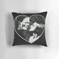Vintage-style pillow featuring Frankenstein and Bride of Frankenstein in a romantic embrace