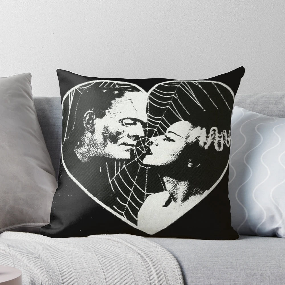 Vintage-style pillow featuring Frankenstein and Bride of Frankenstein in a romantic embrace
